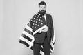 Independence means decide according to law and facts. Businessman bearded man in formal suit hold flag USA. Business
