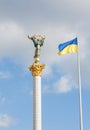 The Independence monument and ukrainian flag in Kiev Royalty Free Stock Photo