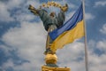 Independence monument and ukrainian flag in Kiev