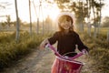 Independent asian child ride her bicycle