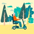 Independent elderly woman, aged 50 , travels on electric scooter. Strong female figure, gray curly hair, smiling. Rest in the Royalty Free Stock Photo