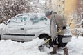 Independent woman shoveling snow in winter.