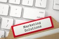 Index Card with Inscription Marketing Solutions. 3d. Royalty Free Stock Photo