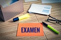 Index cards with legal issues with glasses, pen and bamboo with the german word examen in english exam Royalty Free Stock Photo