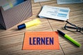 Index cards with legal issues with glasses, pen and bamboo and the german word lernen in english learn Royalty Free Stock Photo