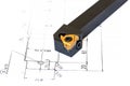 Indexable lathe tool with replaceable tip on blueprint background Royalty Free Stock Photo