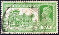 INDIA - CIRCA 1937: A stamp printed in India shows dak tonga and King George VI, circa 1937.