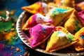 India close up of traditional Holi sweets gujiya and thandai, festival celebration with copy