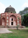 India, Delhi, ancient mausoleum in a tropical park