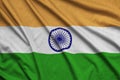 India flag is depicted on a sports cloth fabric with many folds. Sport team banner