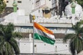 India flag in the middle of old buildings in Hyderabad city suburbs, India