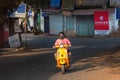 04/04/2020 India, GOA, Arambol, local people riding scooters in an empty city in protective masks during 21 day quarantine and ful