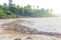 India, Goa, February 05, 2018. Empty plastic and glass bottles lie on the beach and pollute the ecology of the sea Royalty Free Stock Photo