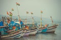 India, Goa - February 2, 2017: Fishing boats with Indian flags stand on the dock