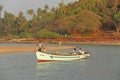 India, GOA, January 19, 2018. Fishermen on boats go to sea. Fishermen in boats are fishing and swimming along the river against Royalty Free Stock Photo