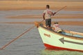 India, GOA, January 19, 2018. Fishermen on boats go to sea. Fishermen in boats are fishing and swimming along the river against Royalty Free Stock Photo