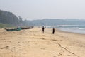 India, GOA, January 22, 2018. People walk along the seashore. Boats on the beach or on the beach Royalty Free Stock Photo