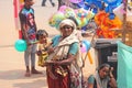 India, GOA, January 28, 2018. Poor woman with a child asks for money on the street in India. A beggar woman with an outstretched