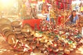 India, Goa. January 24, 2018. A woman sells Tibetan singing bowls made of golden bronze