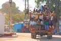 India, Hampi, 02 February 2018. A beautiful Indian truck carries a lot of Indian people. The merry Hindus smile and wave their