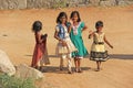 India, Hampi, 02 February 2018. Children of India, in Hampi. A group of Indian children in bright clothes and barefoot, stand and