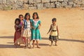 India, Hampi, 02 February 2018. Children of India, in Hampi. A group of Indian children in bright clothes and barefoot, stand and