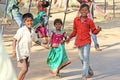 India, Hampi, 02 February 2018. Children of India, in Hampi. A group of Indian children in bright clothes and barefoot, stand and