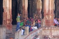 India, Hampi, 01 February 2018. A group of Indian people, bright men and women, waving hands inside the Virupaksha temple, smiling