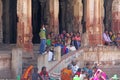 India, Hampi, 01 February 2018. A group of Indian people, bright men and women, waving hands inside the Virupaksha temple, smiling