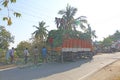 India, Hampi, January 31, 2018. Men are loading large green banana branches into the truck