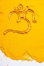 India holy sign Ohm On the texture of turmeric