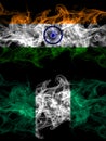 India, Indian vs Nigeria, Nigerian smoky mystic flags placed side by side. Thick colored silky abstract smoke flags