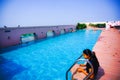 India - jaipur - hotel royal orchid - september 9, 2019, a roof top swimming pool with some people