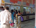 People are buying tickets from ticket counter