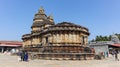 Devotees at.Vidyashankara Temple, rich with sculpted plinth, six doorways and twelve pillars surrounding the mandapa with figures