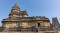 Devotees at.Vidyashankara Temple, rich with sculpted plinth, six doorways and twelve pillars surrounding the mandapa with figures