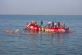 India, Kerala - December 27, 2015: Indian fishermen graphically pull painted Seine right in boat 2. Net painted in bright colors,