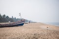 Fishing boat of Indian fishermen on the sandy beach in Kerala, fishing village Marari