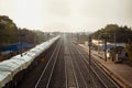 in india a loader train is standing in railway station at left side and a view of empty train metal tracks, a photo from top of Royalty Free Stock Photo