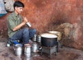 India man preparing sweet masala chai in the middle on the stree