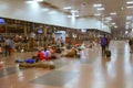 Indian passengers sleep on stone floor of station