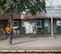 janitor sweeps the platform at the station
