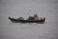 Fisher man fishing with boat in arabian sea water