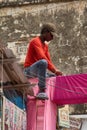 A worker mounts a shopping pavilion