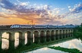 India\'s indigenously developed semi high speed train crossing bridge with nice evening sky and reflection in water Royalty Free Stock Photo