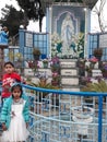 In India in the Shillong Christians church ,there are two children standing infornt the church.
