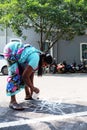 About India Sidewalk Drawing Kolam / Rangoli on floor.