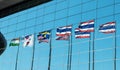 India South Korea Japan Malaysia Sweden America and Thailand flag pole reflection on mirror of building Royalty Free Stock Photo