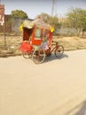 In India, there is a temple on a rickshaw, on the pretext that people do the work of begging loudly. Royalty Free Stock Photo