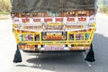 India, 03 25 2023 truck decorated with lucky charms, traditionally pained Indian lorry on the street